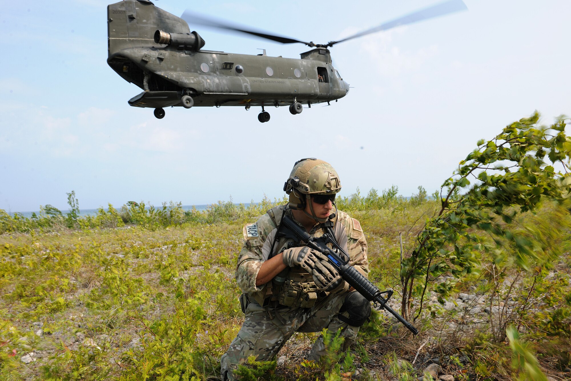 An Air National Guard Joint Terminal Attack Controller takes up a defensive position during Operation Northern Strike at the Alpena Combat Readiness Training Center, Mich., Aug. 11, 2014. (U.S. Air National Guard photo by MSgt. David Kujawa)