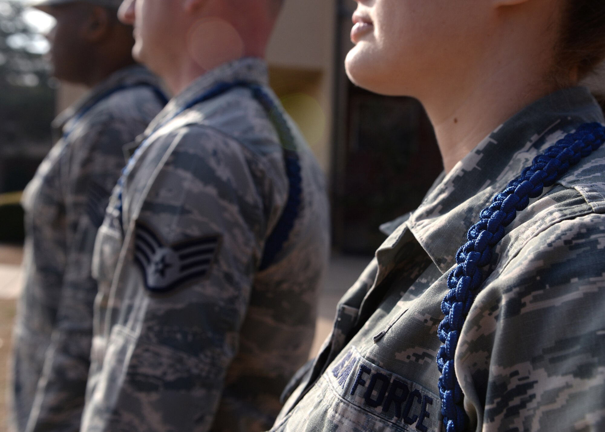 ALTUS AIR FORCE BASE, Okla. – Military training leaders wear blue ropes, known as aiguillettes, on their left shoulder to signify their status as MTLs. Military training leaders are the first supervisors of Airmen in technical training. (U.S. Air Force photo by Airman 1st Class Nathan Clark/Released)