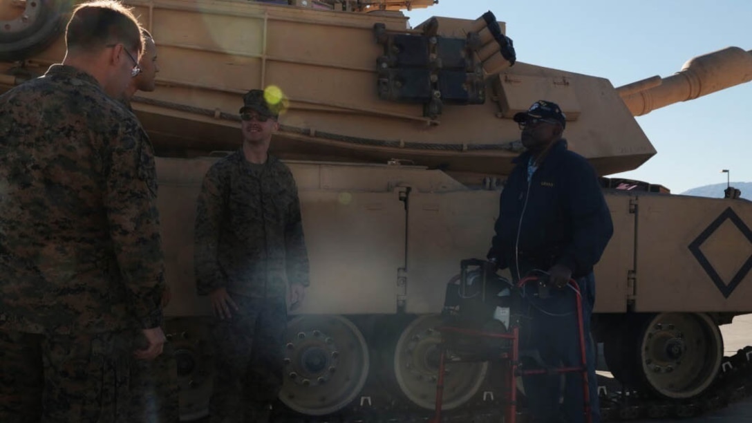 Kenny R. White, Marine veteran, native of San Diego, Calif., passes knowledge to Marines of 1st Tank Battalion on the 1st Tanks Ramp, Dec. 22, 2014. White wanted to be a crewman ever since he was younger, watching the tanks go by on Camp Elliott, Calif. 