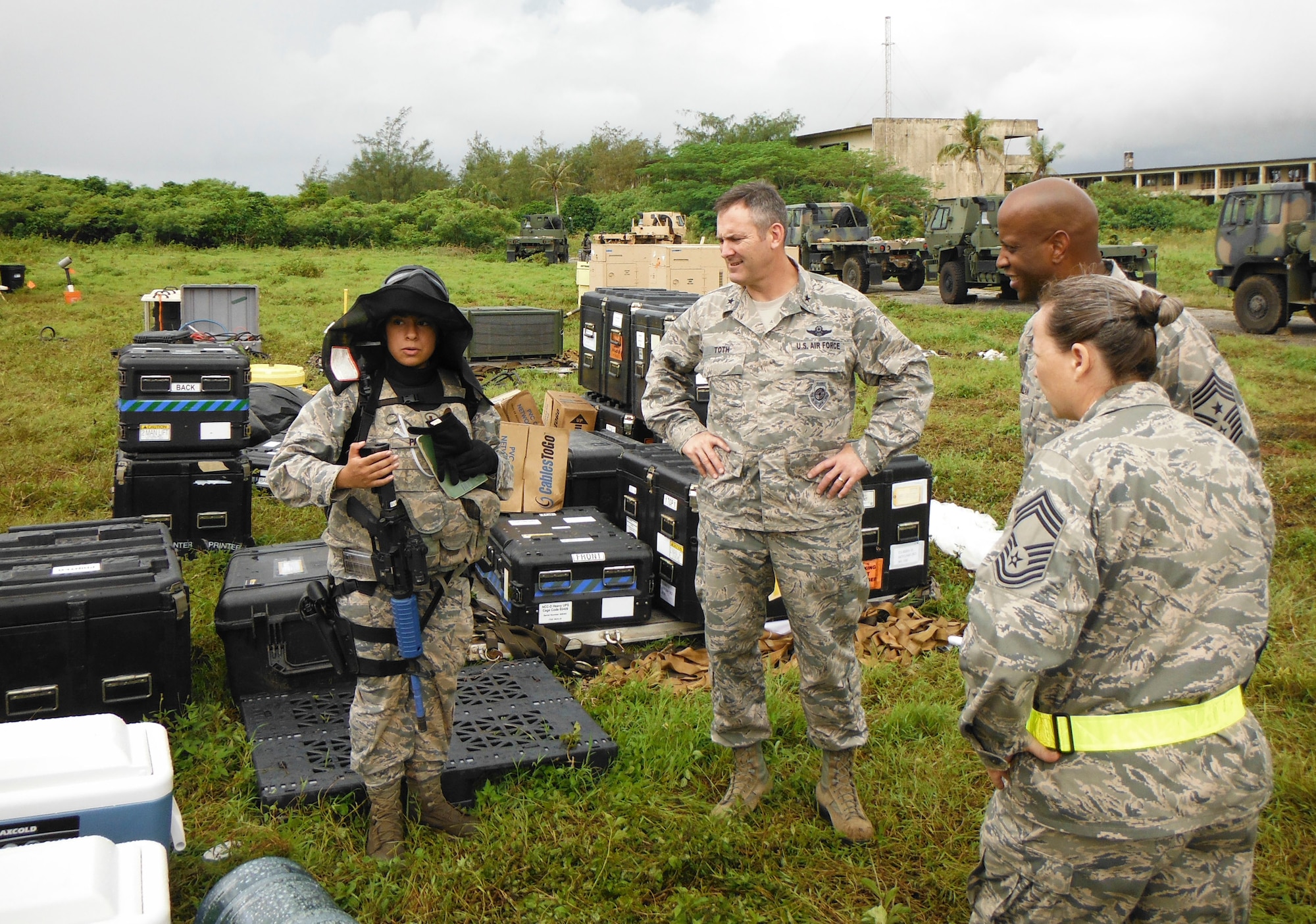 2nd Lt. Denisse Paz briefs Brig. Gen. Andrew Toth and Chief Master Sgt. Michael McMillan on the site and status of the personnel during an exercise Oct. 28, 2014, at Andersen Air Force Base, Guam. The exercise allowed Airmen from the 644th Combat Communications Squadron to exercise their abilities to respond to various scenarios during contingency operations. Paz is the 644th CBCS mission commander. Toth is the 36th Wing commander and McMillan is the 36th Wing command chief. (Courtesy photo)