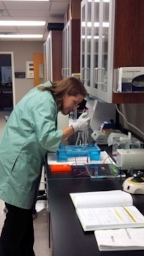 Denise Lindsay, CEGT, loading PCR product onto an agarose gel to verify whole mtDNA amplification of endangered gray bat samples. 