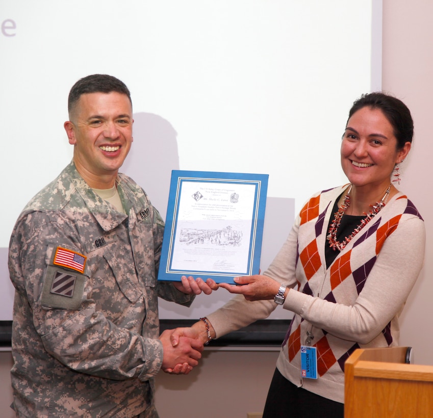 Lt. Col. Charles Gray presents keynote speaker Shelly Lowe with a Bunker Hill certificate during the Native American Heritage Month observance in the New England District Theatre in Concord Park, Concord, Mass., on November 4, 2014.