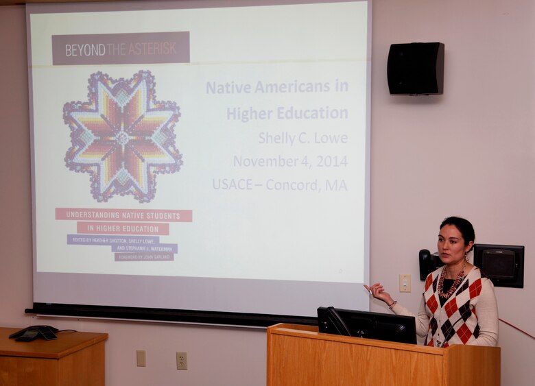 Keynote speaker Shelley Lowe addresses the audience during the Native American Heritage Month observance in the New England District Theatre in Concord Park, Concord, Mass., on November 4, 2014.