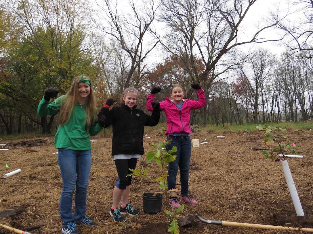 Four adult chaperones and 13 students from the La Crescent Montessori Stem School of La Crescent, Minnesota, voluntarily planted 100 trees in two hours at Goose Island Park, which is located 3 miles south of LaCrosse, Wisconsin, on U.S. Army Corps of Engineers land Oct. 24. The intent of the tree planting project was to control the spread of the invasive reed canary grass (Phalaris arundinacea) in the park. The students, who ranged in age from 12 to 17 years old, also installed fertilizer tablets, animal repellent tablets and 24" trees shelter protectors to each tree. –USACE photo