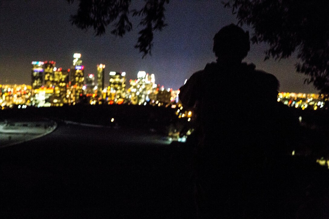 A U.S. Marine with the 15th Marine Expeditionary Unit’s Maritime Raid Force holds security during realistic urban training in Los Angeles Dec. 13, 2014. RUT prepares the 15th MEU’s Marines for their upcoming deployment, enhancing their combat skills in environments similar to those they may find in future missions. (U.S. Marine Corps photo Cpl. Anna Albrecht/Released)