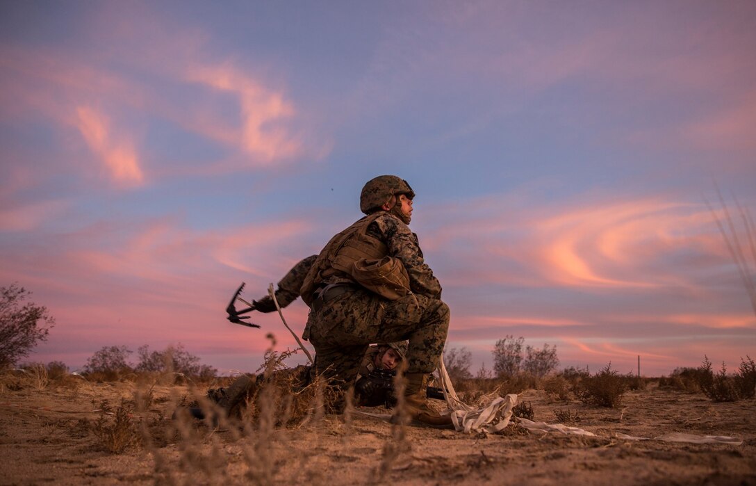 U.S. Marine Lance Cpl. James Grant throws a grappling hook to clear a lane for Marines during a combined arms exercise aboard Marine Corps Air Ground Combat Center, Twentynine Palms, Calif., Dec. 8, 2014. Grant is an assaultman with Battalion Landing Team 3rd Battalion, 1st Marine Regiment, 15th Marine Expeditionary Unit. BLT 3/1 conducted this training concurrent with the 15th MEU’s realistic urban training.  RUT prepares the 15th MEU’s Marines for their upcoming deployment, enhancing their combat skills in environments similar to those they may find in future missions. (U.S. Marine Corps Photo by Sgt. Emmanuel Ramos/Released)