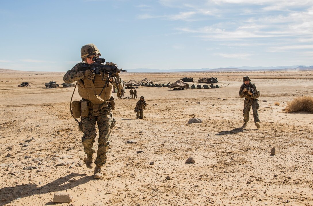 U.S. Marines with Battalion Landing Team 3rd Battalion, 1st Marine Regiment, 15th Marine Expeditionary Unit, conduct marksmanship drills during a combined arms exercise aboard Marine Corps Air Ground Combat Center, Twentynine Palms, Calif., Dec. 10, 2014. BLT 3/1 conducted this training concurrent with the 15th MEU’s realistic urban training.  RUT prepares the 15th MEU’s Marines for their upcoming deployment, enhancing their combat skills in environments similar to those they may find in future missions. (U.S. Marine Corps Photo by Sgt. Emmanuel Ramos/Released)