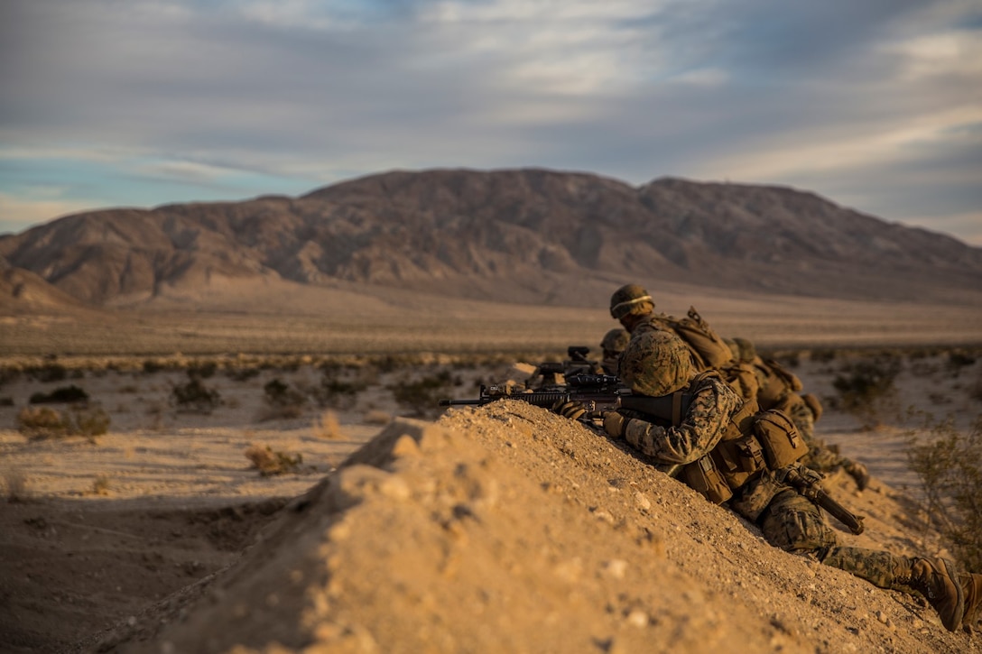 U.S. Marines with Battalion Landing Team 3rd Battalion, 1st Marine Regiment, 15th Marine Expeditionary Unit, conduct marksmanship drills during a combined arms exercise aboard Marine Corps Air Ground Combat Center, Twentynine Palms, Calif., Dec. 10, 2014. BLT 3/1 conducted this training concurrent with the 15th MEU’s realistic urban training.  RUT prepares the 15th MEU’s Marines for their upcoming deployment, enhancing their combat skills in environments similar to those they may find in future missions. (U.S. Marine Corps Photo by Sgt. Emmanuel Ramos/Released)