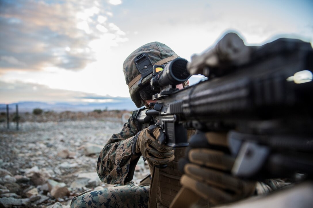 U.S. Marine Lance Cpl. Trent Martin aims in on a target during a combined arms exercise aboard Marine Corps Air Ground Combat Center, Twentynine Palms, Calif., Dec. 12, 2014. Martin is a rifleman with Battalion Landing Team 3rd Battalion, 1st Marine Regiment, 15th Marine Expeditionary Unit. BLT 3/1 conducted this training concurrent with the 15th MEU’s realistic urban training.  RUT prepares the 15th MEU’s Marines for their upcoming deployment, enhancing their combat skills in environments similar to those they may find in future missions. (U.S. Marine Corps Photo by Sgt. Emmanuel Ramos/Released)