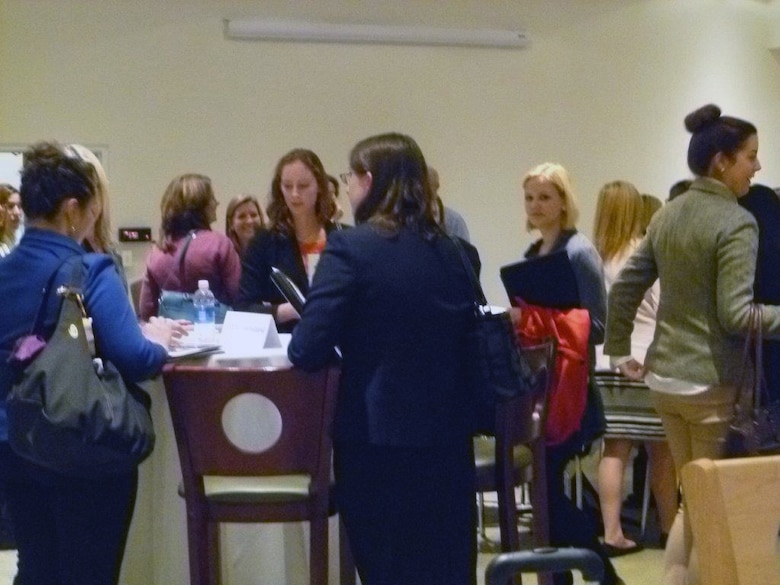 Conference attendees ask questions and get information during the networking session during the Women in STEM Event, Bentley University in Waltham, Massachusetts on Oct. 21, 2014.