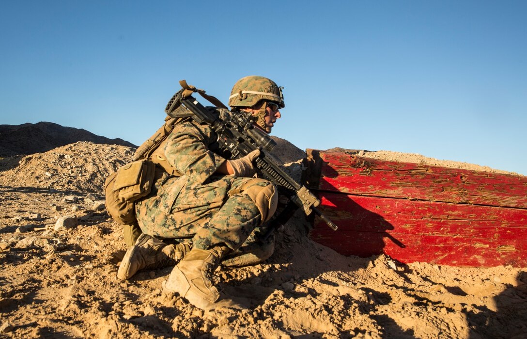 U.S. Marine Lance Cpl. Joseph Burke prepares to engage targets during a combined arms training aboard Marine Corps Air Ground Combat Center, Twentynine Palms, Calif., Dec. 13, 2014. Burke is a team leader with Battalion Landing Team 3rd Battalion, 1st Marine Regiment, 15th Marine Expeditionary Unit. BLT 3/1 conducted this training concurrent with the 15th MEU’s realistic urban training.  RUT prepares the 15th MEU’s Marines for their upcoming deployment, enhancing their combat skills in environments similar to those they may find in future missions. (U.S. Marine Corps Photo by Sgt. Emmanuel Ramos/Released)