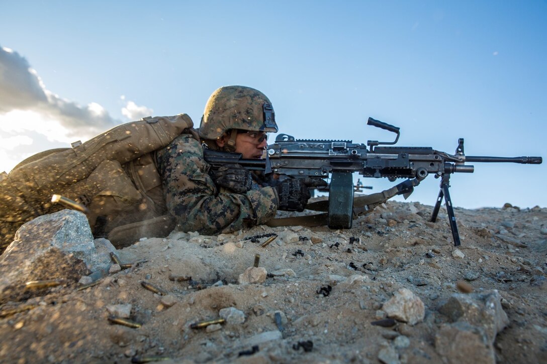 U.S. Marine Pfc. Andres Bravo engages targets during a combined arms exercise aboard Marine Corps Air Ground Combat Center, Twentynine Palms, Calif., Dec. 13, 2014. Bravo is a rifleman with Battalion Landing Team 3rd Battalion, 1st Marine Regiment, 15th Marine Expeditionary Unit. BLT 3/1 conducted this training concurrent with the 15th MEU’s realistic urban training.  RUT prepares the 15th MEU’s Marines for their upcoming deployment, enhancing their combat skills in environments similar to those they may find in future missions. (U.S. Marine Corps Photo by Sgt. Emmanuel Ramos/Released)