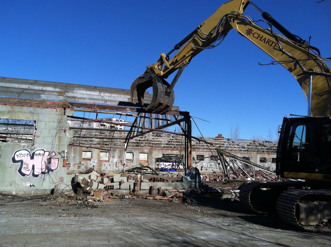Buildings are demolished as part of the remedial action plan for the Watertown GSA Formerly Used Defense Site.