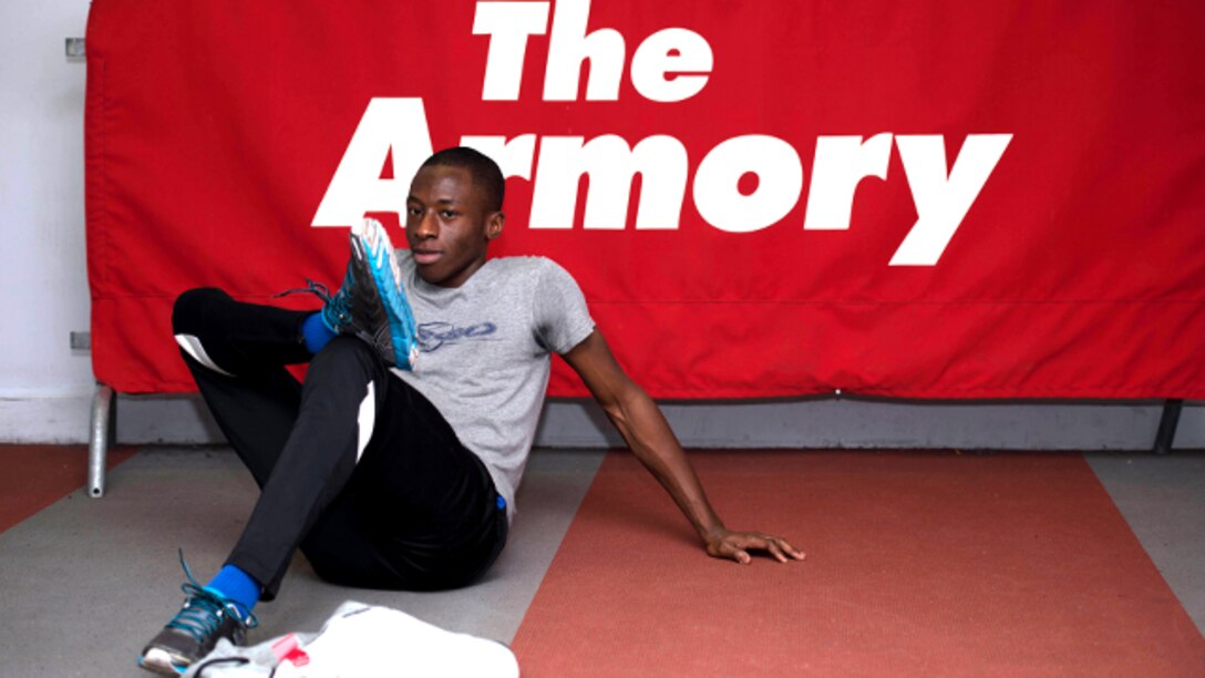 New York City—A student athlete stretches preceding his event during the 2014 Marine Corps Holiday Classic at the New Balance Track and Field Center, Dec. 29. This year’s event was the 15th Annual Marine Corps Holiday Classic. More than 83 high schools in the tri-state area participated in the event. 