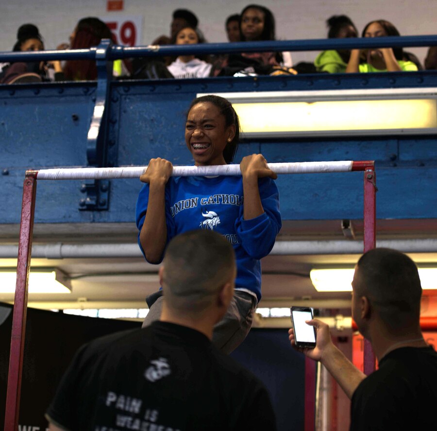 New York City—A student athlete gives the Marine’s pull-up challenge a try during the 2014 Marine Corps Holiday Classic at the New Balance Track and Field Center, Dec. 29. The event is held to generate awareness of the Marine Corps and gather leads of quality young men and women for potential future service. 