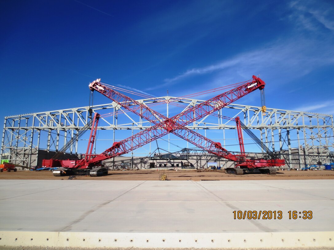 2014 District Photo Drive entry. Photo by Garry Vollbrecht, Oct. 3, 2014.  “Two Manitowoc cranes after setting the main box truss at the FY-12 Two Bay Hangar at Cannon Air Force Base, N.M.”