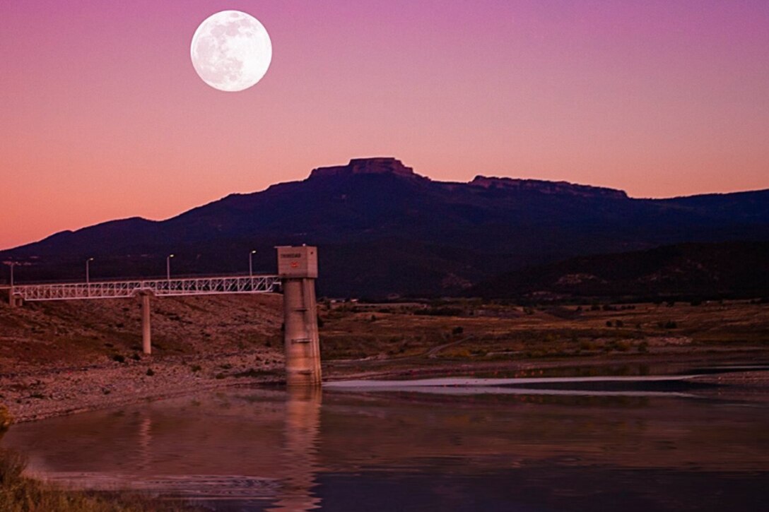 TRINIDAD LAKE, Colo., -- The moon rises as the sun sets at the lake in October 2014.  This photo placed 2nd in the District’s annual photo drive based on employee voting. Photo by Joseph Torres.