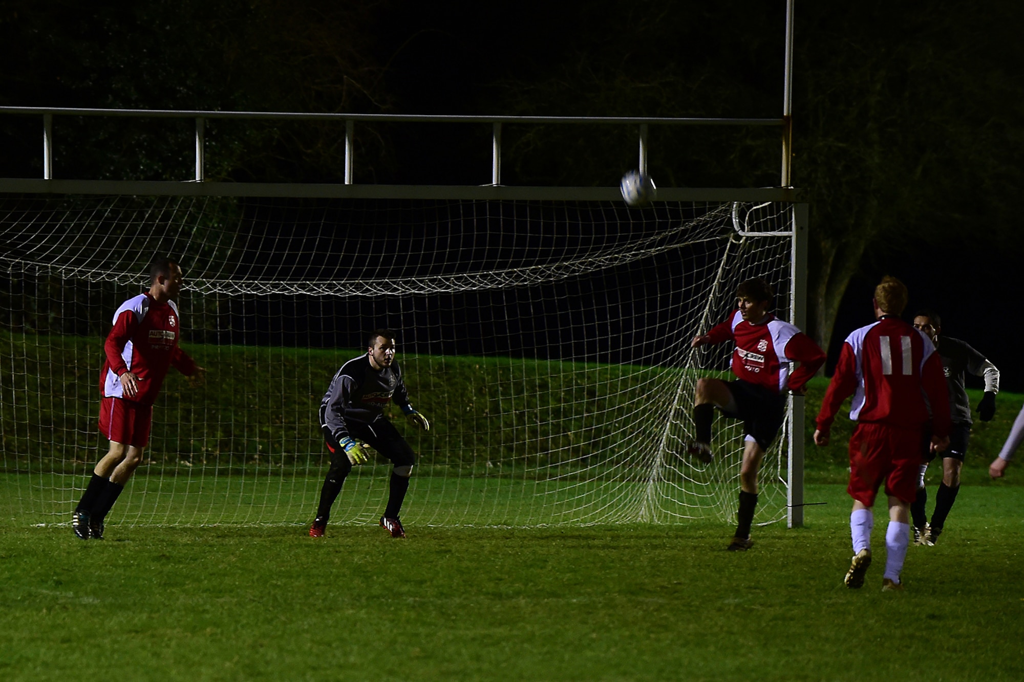 Banbury Galaxy Football Club goalkeeper and defenders defend against an RAF Croughton Football Club attack at RAF Croughton, England, Dec. 10, 2014. The object of the game is to advance the ball through running, passing and dribbling the ball past the opposing team and into their goal. (U.S. Air Force photo by Tech. Sgt. Chrissy Best/Released)