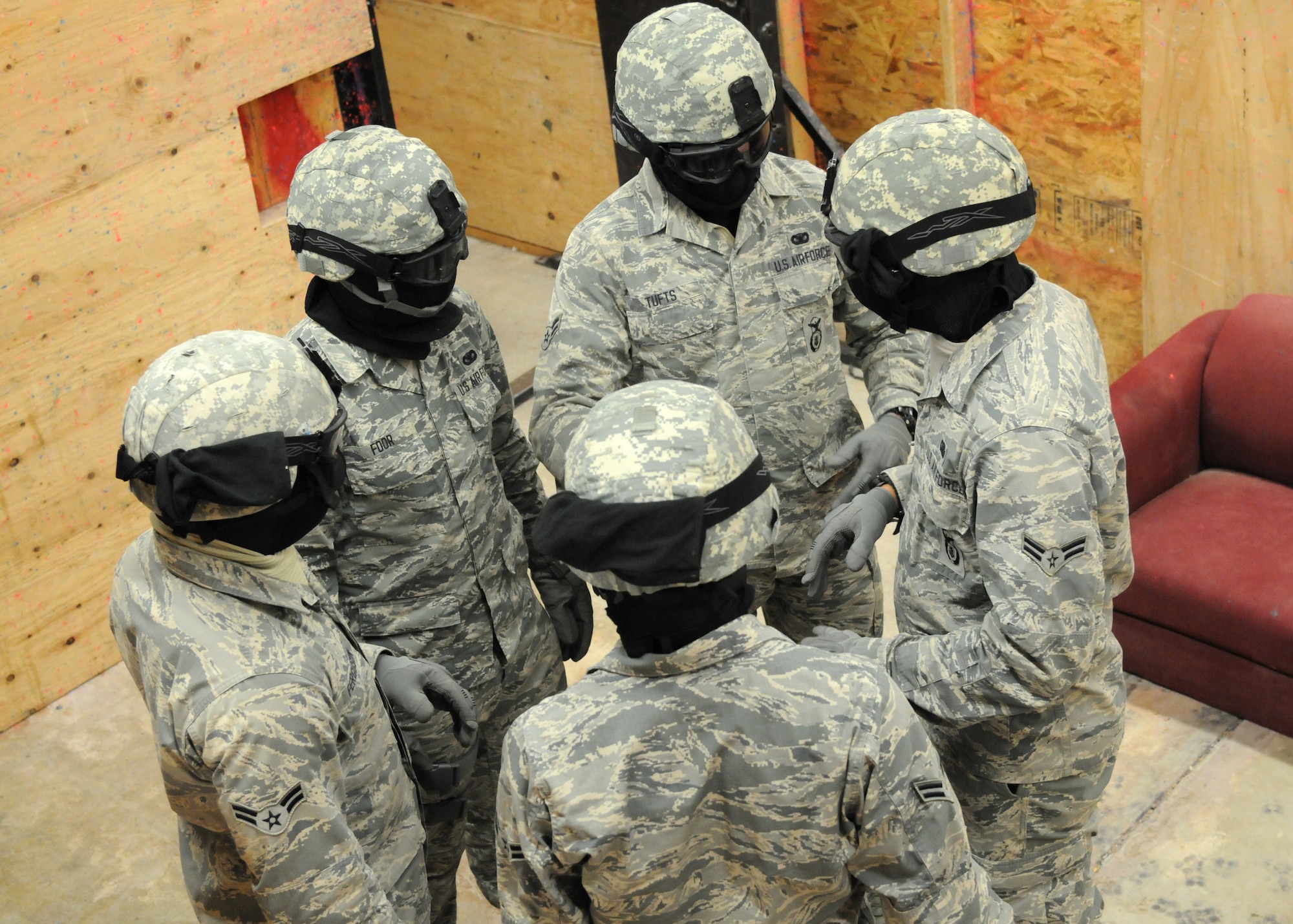 Security forces Airmen discuss their strategy prior to an active shooter scenario Dec. 22, 2014, in the shoot house on F.E. Warren Air Force Base, Wyo. During the training Airmen are taught the importance of teamwork and to go directly to the threat . (U.S. Air Force photo/Airman 1st Class Malcolm Mayfield)