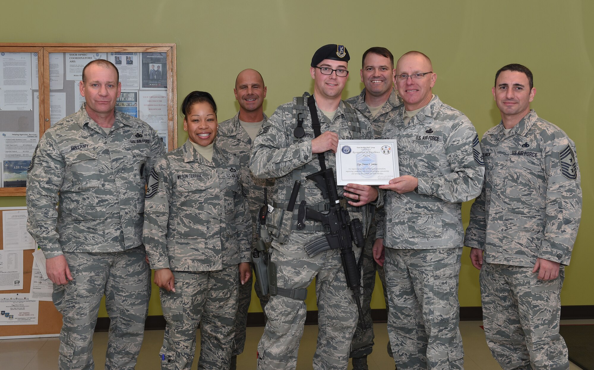 Staff Sgt. Trevor Simms, 460th Security Forces Squadron, received the Team Buckley Chiefs’ Group Recognition of Excellence Award Dec. 30, 2014, on Buckley Air Force Base, Colo. The award is given each month to one outstanding Team Buckley member. (U.S. Air Force photo by Airman 1st Class Samantha Saulsbury/Released)