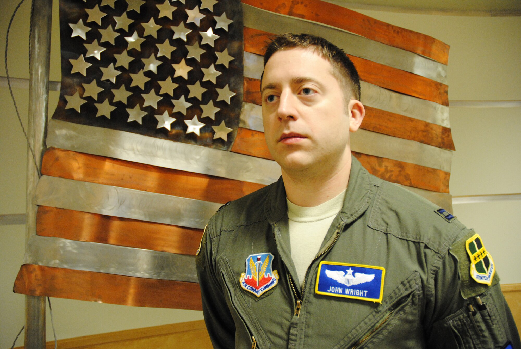 Capt. John Wright from the 348th Reconnaissance Squadron, poses for a photo Dec. 23, 2014, at Heritage Hall at Grand Forks Air Force Base, N.D. The nine-year Air Force Veteran from St. Louis was recently selected to be part of the Mansfield Fellowship Program. The Mansfield Fellowship Program was established by the U.S. Congress in 1994 to build a corps of U.S. federal government employees with proficiency in the Japanese language and practical, firsthand knowledge about Japan and its government.  (U.S. Air Force photo illustration/Staff Sgt. Luis Loza Gutierrez)
