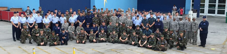 Members from 10 military affiliated organizations joined Airmen from the 927 ARW December 26, 2014 for the opening ceremony of the 2014 BitCoin Bowl at Tropicana Field in St. Petersburg FL. Over 150 uniformed volunteers bordered a field size U.S. flag during the National Anthem, followed by four Army Green Berets repelling down to the 50-yard line to perform the coin toss. (Civil Air Patrol Photo/Cadet 1st Lt. Antoinette Barnes)