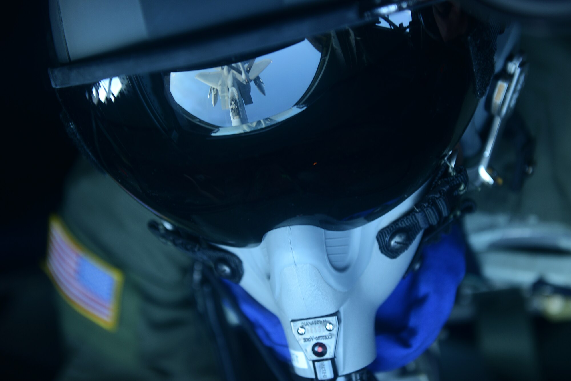 U.S. Air Force Senior Airman Charlton Hampton, 909th Air Refueling Squadron boom operator, refuels a U.S. Air Force F-15C Eagle from Kadena Air Base, Japan, from a KC-135 Stratotanker near Okinawa, Japan, Dec. 23, 2014. Mid-air refueling gives the Air Force the ability to extend the range of its aircraft and is integral to the global reach of its military power and humanitarian relief in the event of a crisis. (U.S. Air Force photo by Senior Airman Maeson L. Elleman)