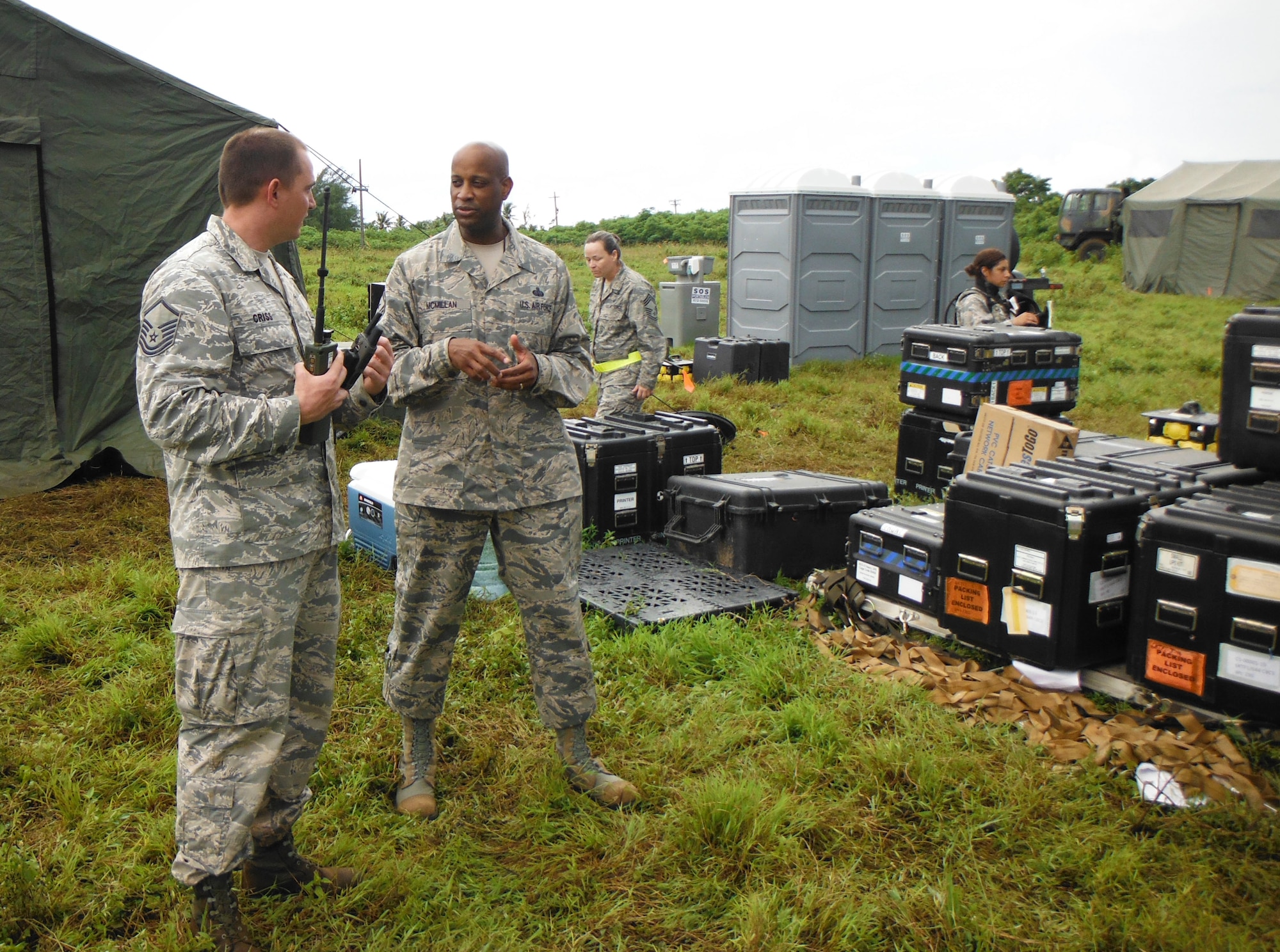 Master Sgt. Joshua Criss, 644th Combat Communications Squadron wing inspection team lead, and Chief Master Sgt. Michael McMillan, 36th Wing command chief, discuss training tactics and procedures during an exercise Oct. 28, 2014, at Andersen South, Guam. The exercise allowed Airmen from the 644th CBCS to exercise their abilities to respond to various scenarios during contingency operations. (U.S. Air Force courtesy photo/Released)