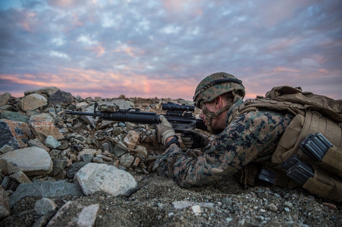 U.S. Marine Lance Cpl. Zachary Thompson aims in on a target during a combined arms exercise aboard Marine Corps Air Ground Combat Center, Twentynine Palms, Calif., Dec. 12, 2014. Thompson is a rifleman with Battalion Landing Team 3rd Battalion, 1st Marine Regiment, 15th Marine Expeditionary Unit.  BLT 3/1 conducted this training concurrent with the 15th MEU’s realistic urban training.  RUT prepares the 15th MEU’s Marines for their upcoming deployment, enhancing their combat skills in environments similar to those they may find in future missions. (U.S. Marine Corps Photo by Sgt. Emmanuel Ramos/Released)