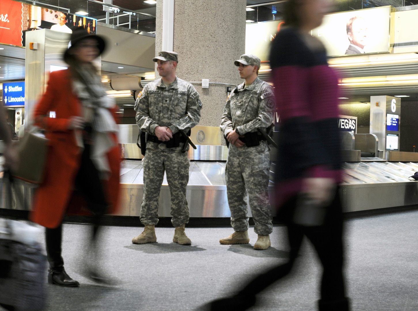 Spc. James Jackson, left, and Sgt. Christopher McClung of the 485th Military Police Company monitor activity in the baggage claim area at McCarran International Airport in Las Vegas on a previous New Year’s Eve while participating in the Vigilant Sentinel exercise. About 200 Nevada Guard Soldiers and Airmen participated in the exercise that coincided with the New Year’s holiday.


