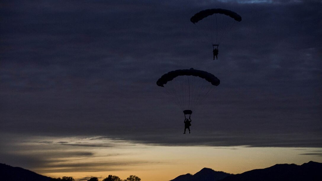 U.S. Marines with the Force Reconnaissance Detachment, 15th Marine Expeditionary Unit, conduct a static-line jump from an MV-22B Osprey during realistic urban training aboard Fort Hunter Liggett, Calif., Dec. 9, 2014. These Marines are part of the 15th MEU’s Maritime Raid Force. The purpose of RUT is to provide the MEU an opportunity to conduct training in unfamiliar environments in preparation for their upcoming deployment. 
