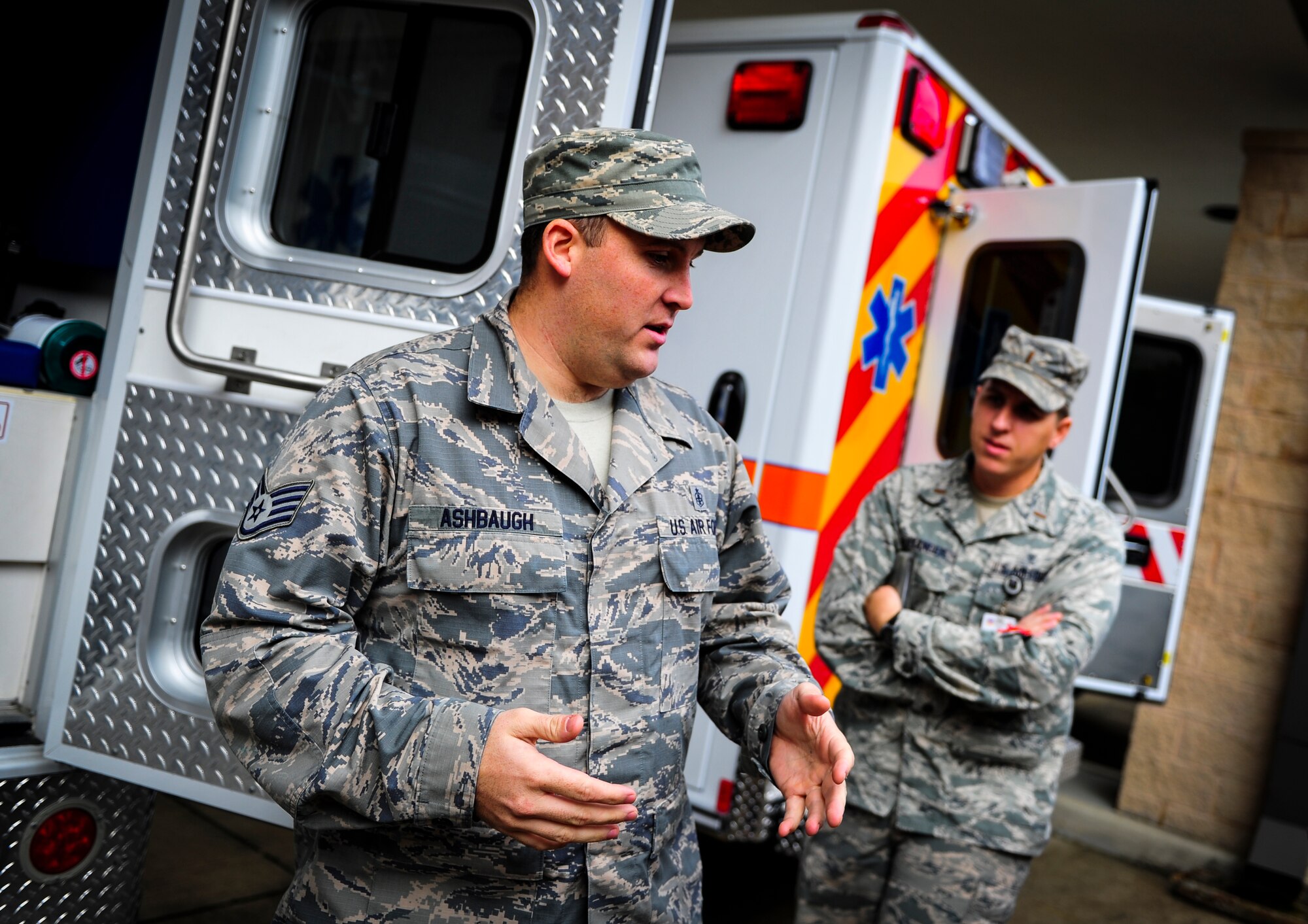 Staff Sgt. Brock Ashbaugh, 1st Special Operations Medical Operations Squadron ambulatory service paramedic, explains the differences between the new and older ambulances on Hurlburt Field, Fla., Dec. 30, 2014. The 1st SOMDOS received one of three new ambulances to add to their fleet. (U.S. Air Force photo/Senior Airman Christopher Callaway) 