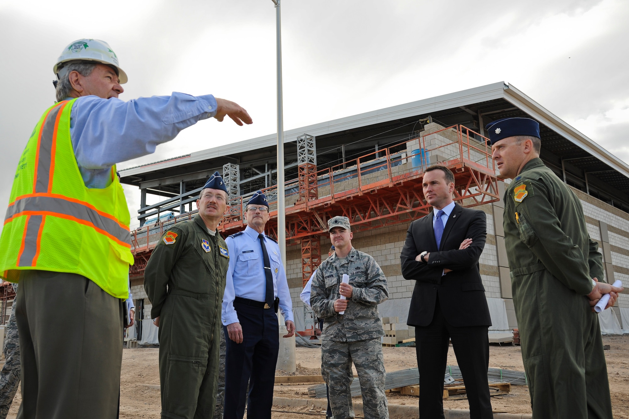 Undersecretary of the Air Force Eric Fanning is briefed by Craig Killmer during a tour of the Academic Training Center construction site on March 14, 2014, at Luke Air Force Base, Ariz. The 145,000 square-foot facility will include pilot academic training classrooms, 12 F-35 simulators, a secured briefing auditorium, and space for administrative, instructor and engineering personnel. Killmer is the Archer Western Contractors project manager. (U.S. Air Force photo/Staff Sgt. Darlene Seltmann)