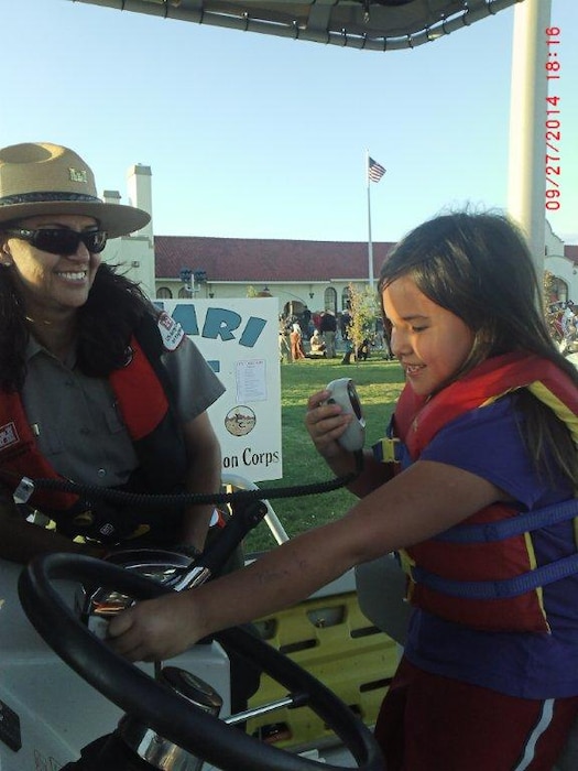 2014 District Photo Drive entry. Photo by Valerie Mavis, Sept. 27, 2014. “Seasonal Park Ranger Nadine Carter helps educate the public during a community event in Tucumcari N.M.”

