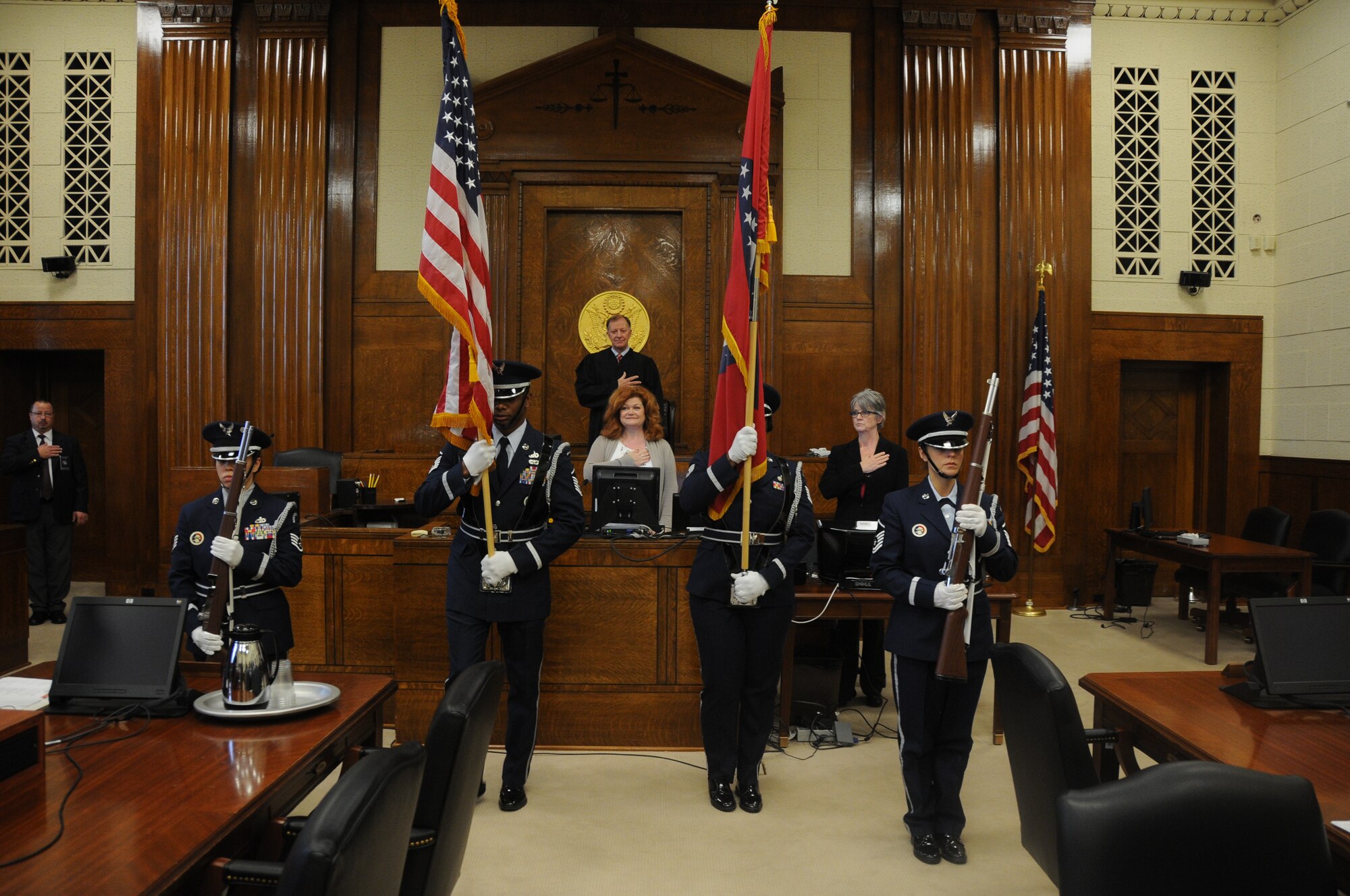 Members of the 188th Wing Honor Guard post the colors during a naturalization ceremony at the U.S. District Court at Fort Smith, Ark., Dec. 12, 2014. During the ceremony, people take the Oath of Allegiance to complete the process of becoming a U.S. citizen. (U.S. Air National Guard photo by Airman 1st Class Cody Martin/released)