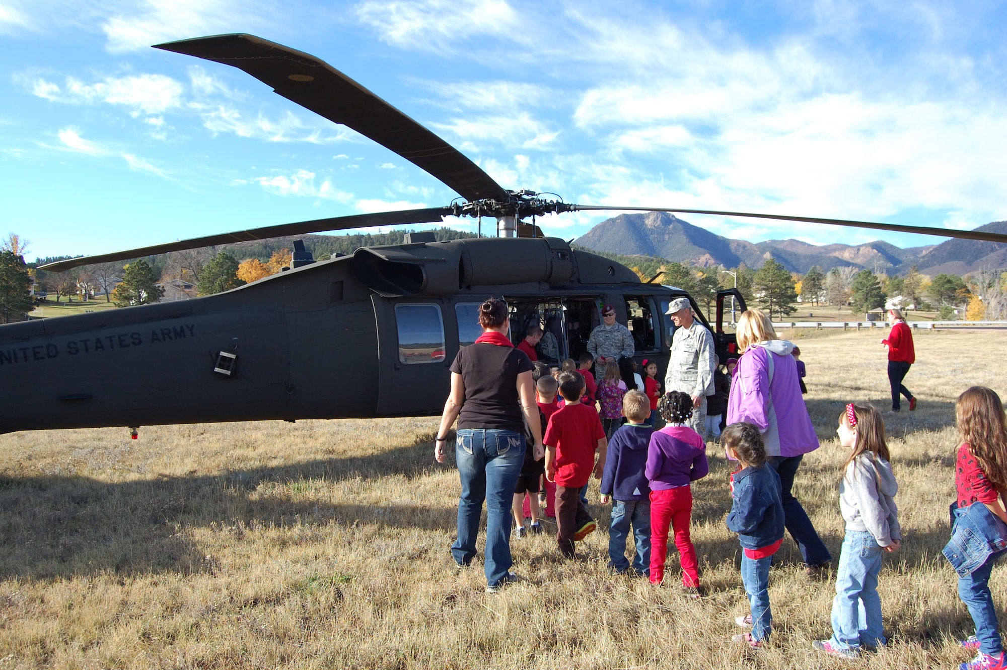 Students attending Douglass Valley Elementary School, Colorado Springs, Colo. received a visit from the Colorado Joint Counterdrug Task Force during their Red Ribbon Week October 21, 2014. Members of the CO-JCDTF and Drug Enforcement Agency flew into the schoolyard in a Colorado National Guard Blackhawk and talked to the children about making good choices to stay healthy and drug free. (U.S. Air National Guard photo by Capt. Kinder Blacke) 