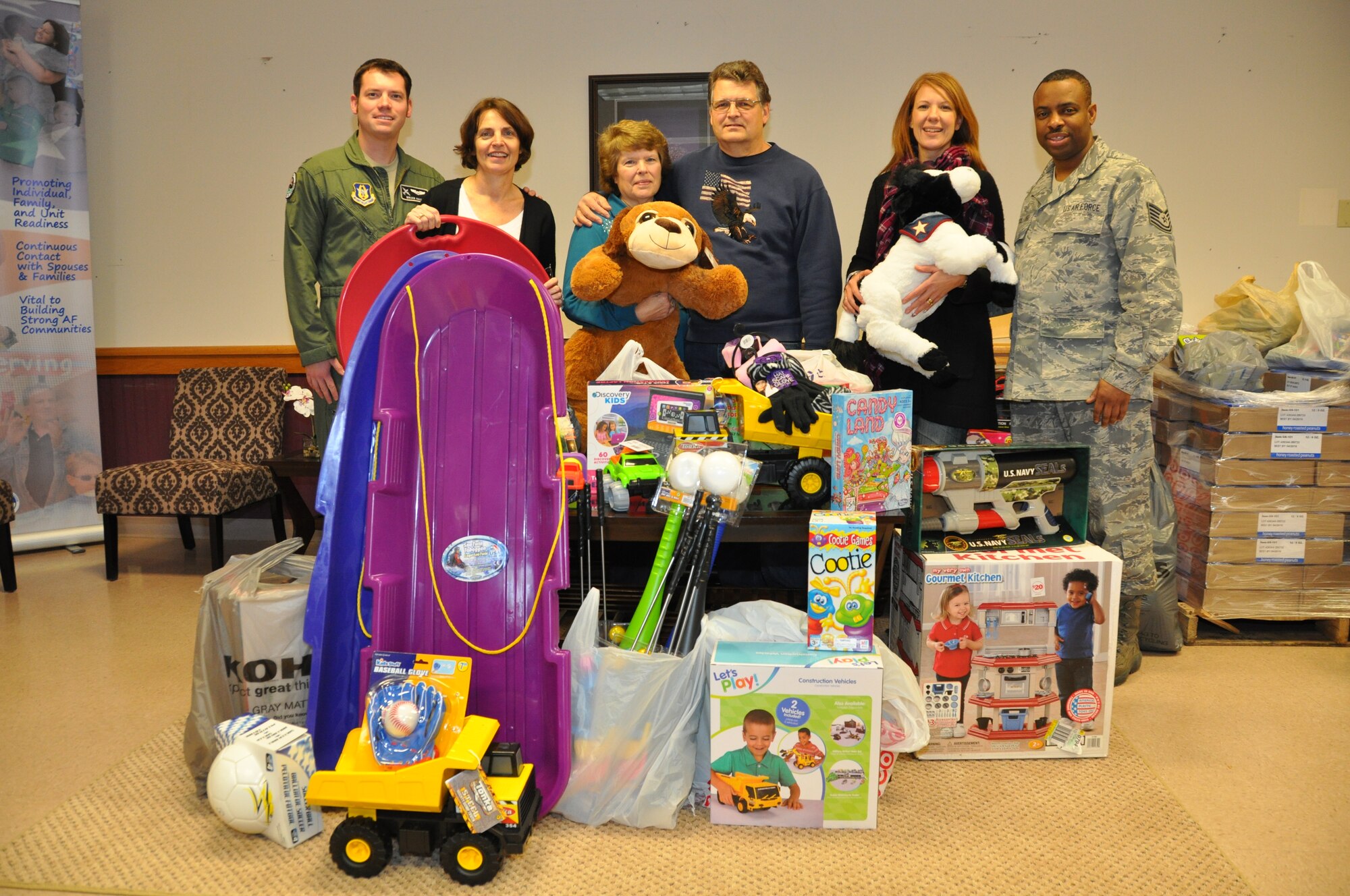 (L to R) 1st Lt. Brian Haun, 914th Airlift Wing Yellow Ribbon Coordinator; Patty Braun, 914 AW Executive Officer; Linda and Donald Sahlem; Holly Curcione, Friends of Family Support Treasurer; Tech. Sgt. Terrence McCullough, 914 AW Airman & Family Readiness Center Technician.  Linda and Donald Sahlem, as is their custom each year, donated over 100 toys to the 914 AW Airman & Family Readiness Center which were distributed to family members of personnel at the Niagara Falls Air Reserve Station, N.Y. December 5, 2014.  (U.S. Air Force photo by Master Sgt. Kevin Nichols)