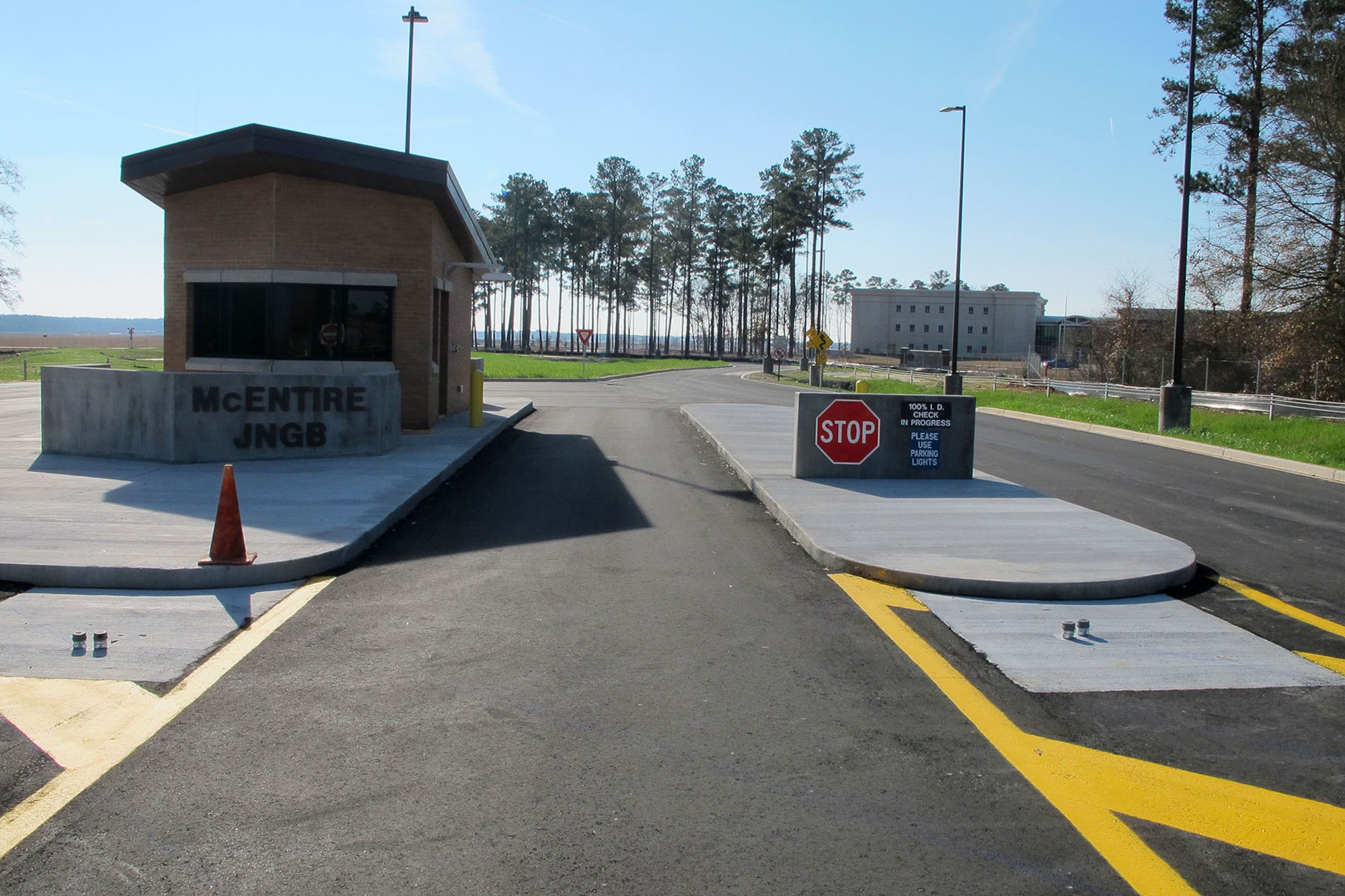 The South Carolina Air National Guard at McEntire Joint National Guard Base, S.C. is wrapping up the $2.2 million new front gate project in January. This National Guard Bureau-funded project features facility improvements are the culmination of planning since 2009, and construction which started in early 2014. The changes at the main gate makes the base current with Department of Defense antiterrorism standards, and features a new gate and gate house, a commercial vehicle inspection area, and a final denial barrier. The new gate house now sits 100 feet further back from Highway 378, complete with anti-ramming protection and ballistic glass. (U.S. Air National Guard photo by 2nd Lt. Stephen Hudson/Released)