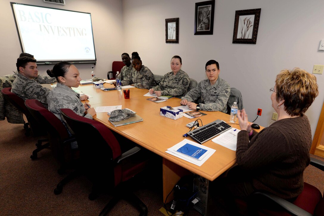 Airmen from units throughout Ellsworth participate in a basic investing course led by Laurie Adkins, 28th Force Support Squadron Airman and Family Readiness Center community readiness consultant, in the AFRC at Ellsworth Air Force Base, S.D., Dec. 18, 2014. The AFRC offers this class monthly to all Airmen interested, in addition to several other finance classes that assist with vehicle buying and building credit.  (U.S. Air Force photo by Airman 1st Class Rebecca Imwalle/ Released)