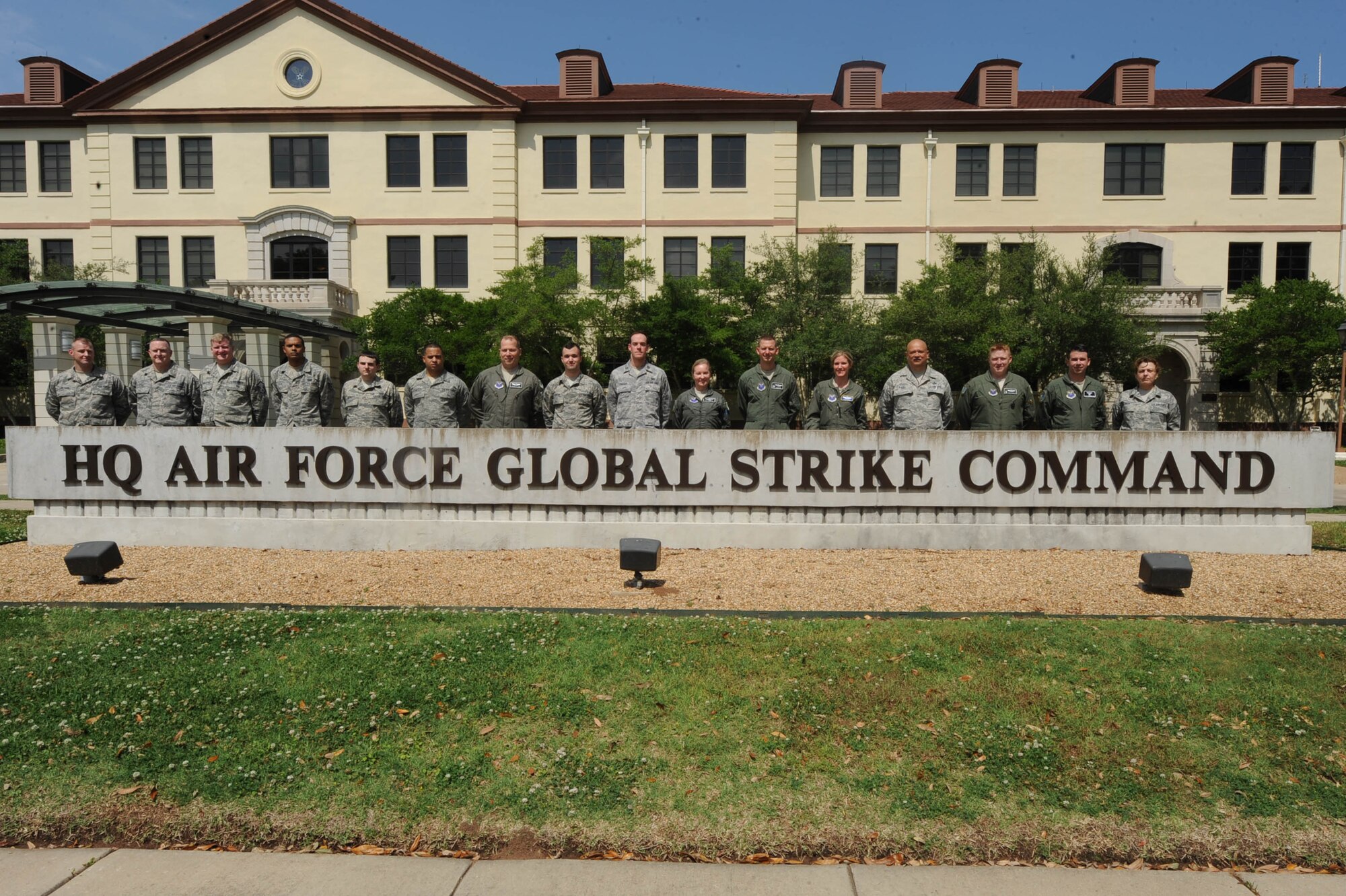 Seventeen members of the 102nd Air Operations Group, from Otis Air National Guard Base, stand in front of the Air Force Global Strike Command Headquarters on Barksdale AFB, Louisiana, while participating in Exercise Global Lightning '14. (U.S. Air Force photo by Staff Sgt. Sean Martin)