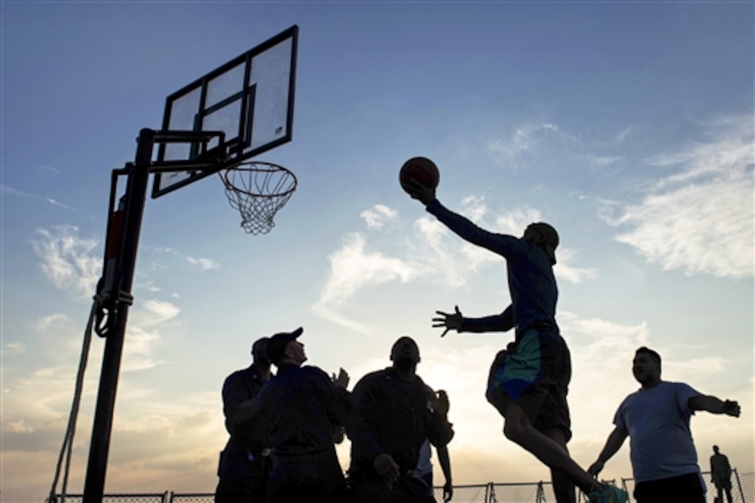 U.S. sailors play basketball on the flight deck of guided-missile destroyer USS Mitscher during a steel beach picnic in the U.S. 5th Fleet area of responsibility, Dec. 26, 2014. The destroyer is supporting Operation Inherent Resolve, which includes strike operations in Iraq and Syria as directed.