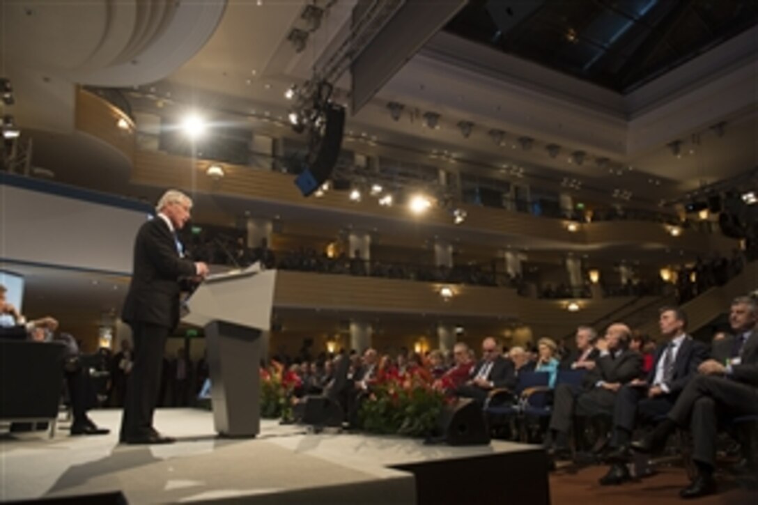 U.S. Defense Secretary Chuck Hagel delivers a speech during a joint panel with U.S. Secretary of State John F. Kerry, left, at the Munich Security Conference in Germany, Feb. 1, 2014. 