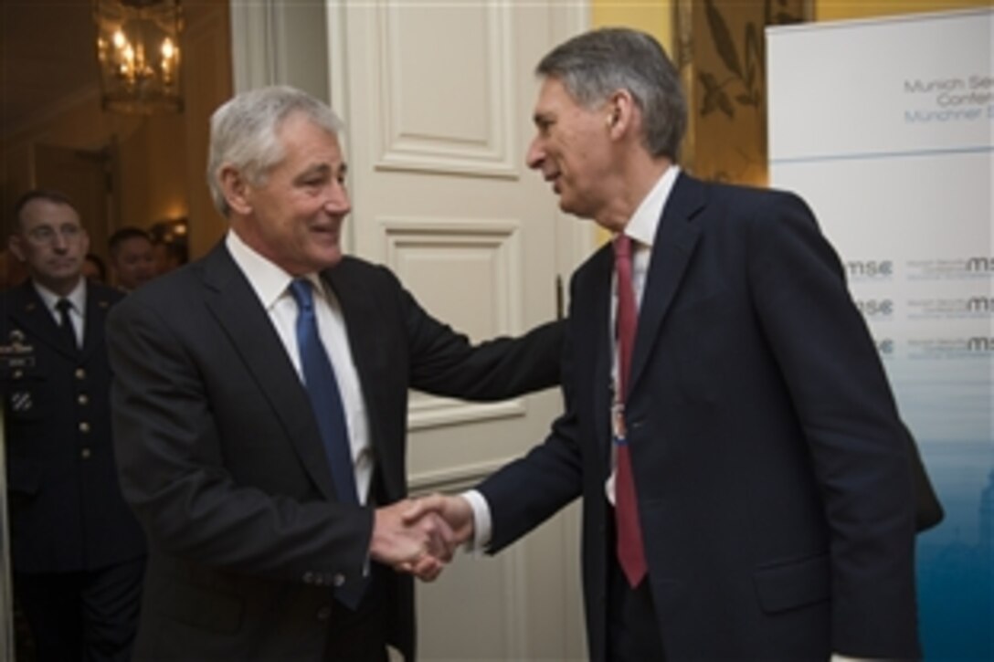 U.S. Defense Secretary Chuck Hagel, left, meets with British Defense Secretary Philip Hammond at the Munich Security Conference in Germany, Feb. 1, 2014. 