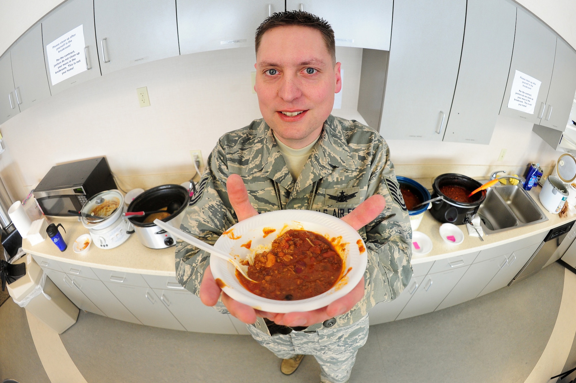 Air Force Reserve Tech. Sgt. Richard Schafer shows off a steaming bowl of chili Feb. 1, 2014, at Schriever Air Force Base, Colo. It was one of 12 different chilis and soups that he sampled during the 310th Space Wing Top-3 chili and soup cook-off. The cook-off was held to raise money for the 310th SW annual awards banquet in March. The Top-3 is an association of senior non-commissioned officers that promote military professionalism, development and quality of life for all enlisted personnel. (U.S. Air Force photo/Tech. Sgt. Nicholas B. Ontiveros)