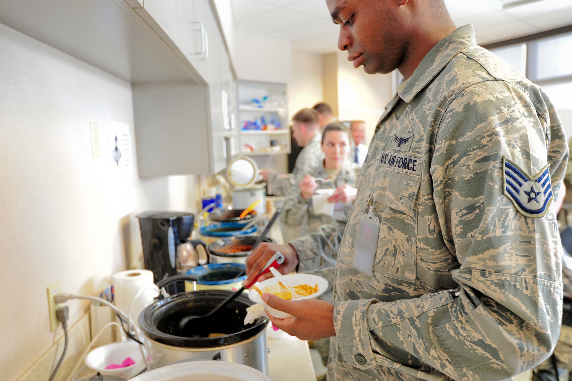 Air Force Reserve Staff Sgt. Matthew Cleveland tries another chili sample Feb. 1, 2014, at Schriever Air Force Base, Colo. For Cleveland and others, it was one of 12 different chilis and soups to taste during the 310th Space Wing Top-3 chili and soup cook-off. The cook-off was held to raise money for the 310th SW annual awards banquet in March. The Top-3 is an association of senior non-commissioned officers that promote military professionalism, development and quality of life for all enlisted personnel. (U.S. Air Force photo/Tech. Sgt. Nicholas B. Ontiveros)