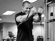 Staff Sgt. Jovie Santos, from the 919th Security Forces Squadron, performs cable crossovers at the fitness center at Duke Field, Fla.  The fitness center hours of operation are 4 a.m. to 11 p.m.  Monday through Friday (U.S. Air Force photo/Tech. Sgt. Jasmin Taylor)