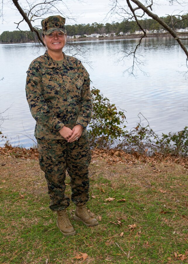 Religious Program Specialist 2nd Class Sarah Reza, 26th Marine Expeditionary Unit (MEU), poses for a photo outside the 26th MEU command post aboard Marine Corps Base Camp Lejeune, N.C., Jan. 10, 2014. Reza works with the MEU chaplain to provide religious assistance, counseling and guidance to Marines and Sailors with the MEU. (U.S. Marine Corps photo by Lance Cpl. Joshua Brown/Released)