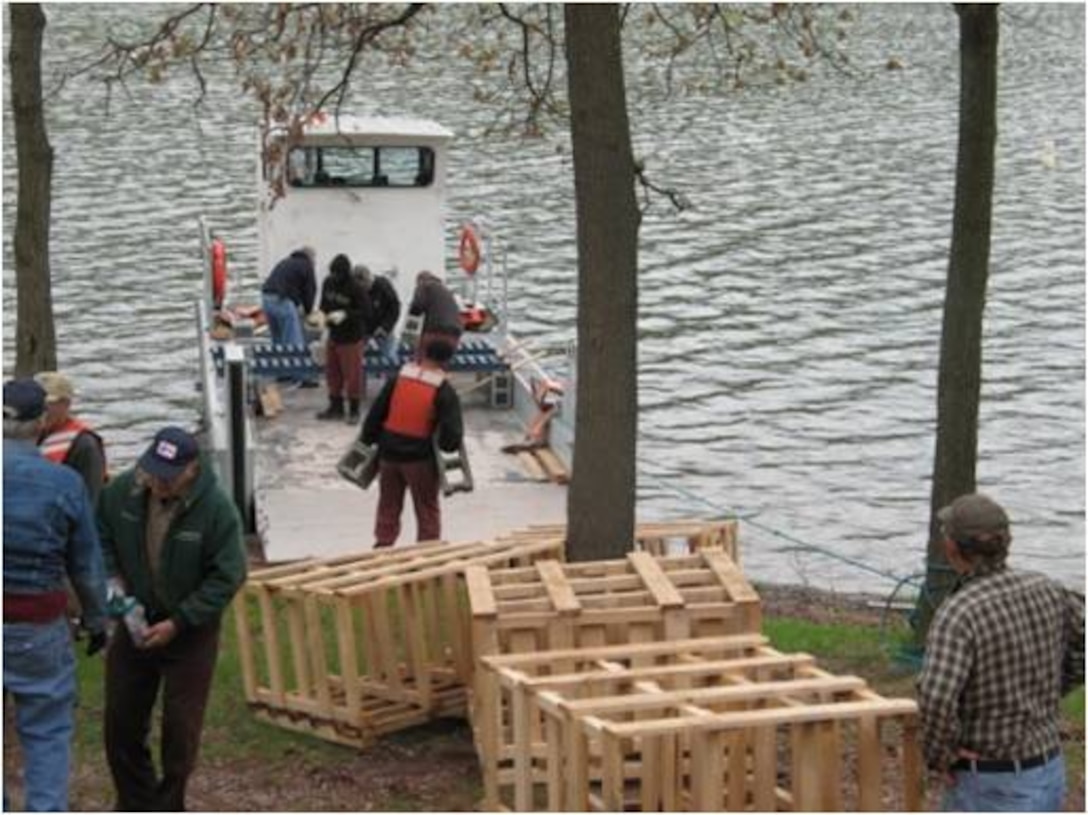 Corps members and volunteers prepare artificial structures for fisheries management.