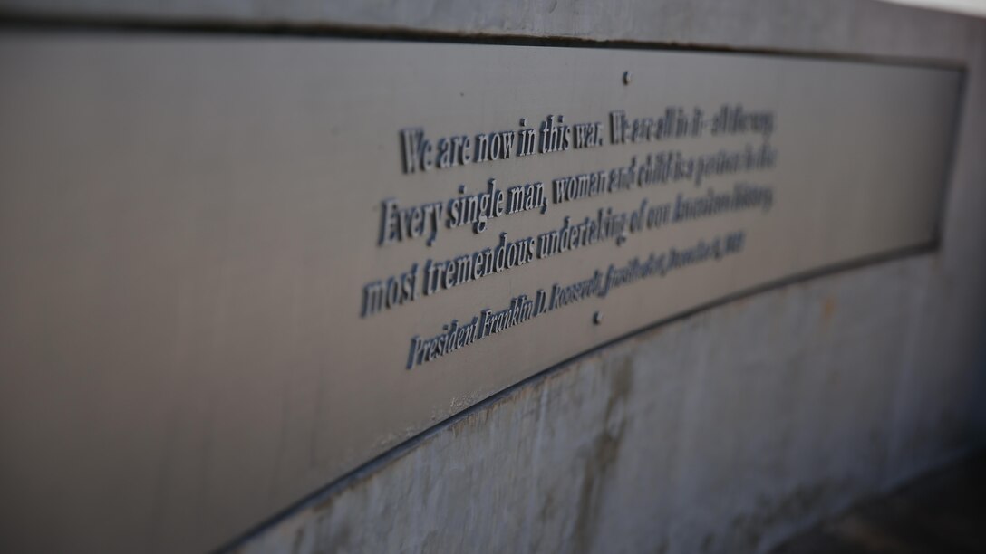 This plaque, found in the Pearl Harbor Historic Sites for the USS Arizona Memorial and Museum, is an excerpt from President Franklin D. Roosevelt’s Dec. 9, 1942, 'Fireside Chat' to the American people describing the events at Pearl Harbor. The quote reads "We are now in this war. We are all in it – all the way. Every single man, woman and child is a partner in the most tremendous undertaking of our American history."
