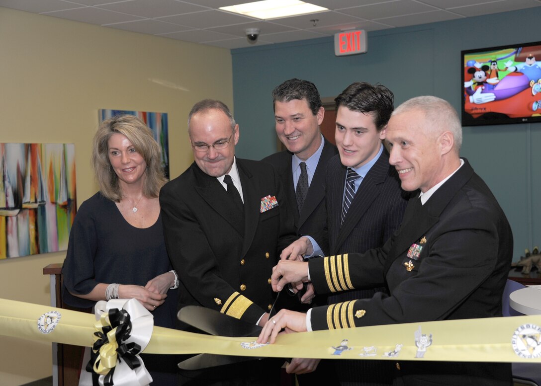 From left to right-Nathalie Lemieux, Rear Adm. C. Forrest Faison III, Mario Lemieux, Austin Lemieux and Capt. Mark A. Kobelja get ready to officially open “Austin’s Playroom” at the new Naval Hospital Camp Pendleton Jan. 29. The playroom was built from donations of private individuals and corporations and will be the second playroom established as an initiative of the Mario Lemieux Foundation on a military installation. The opening of this room makes a total of 29 Austin’s Playrooms opened. Faison is the Deputy Surgeon General of the Navy and Deputy Chief of the Navy’s Bureau of Medicine and Surgery, and Kobelja is the NHCP Commanding Officer. 